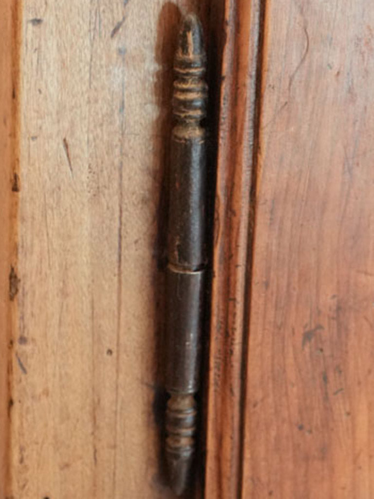 Warm-toned walnut armoire