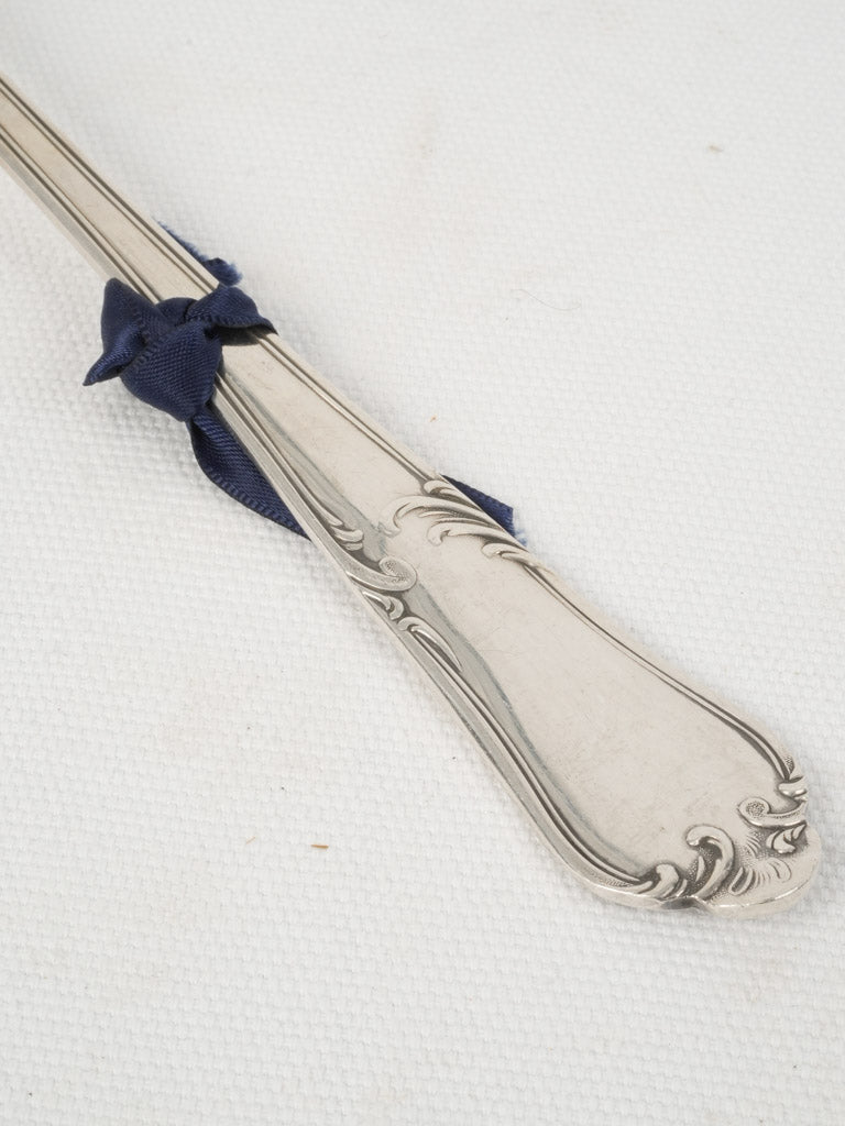 Ornate silver-plated soup ladle