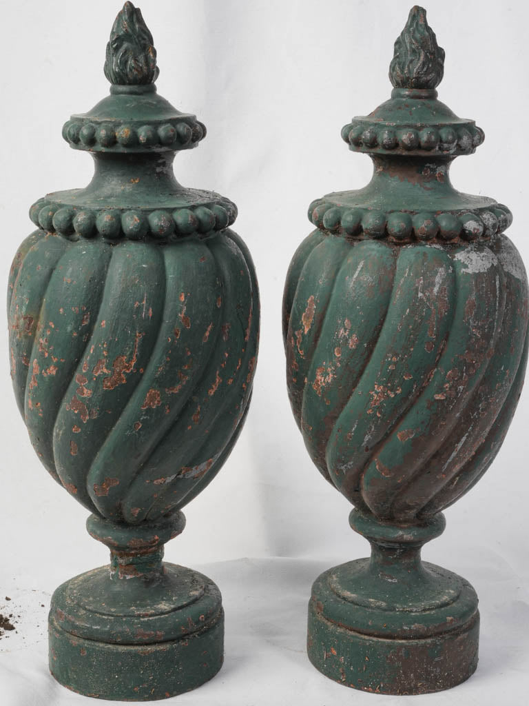 Neoclassical bottle-green urn sculptures