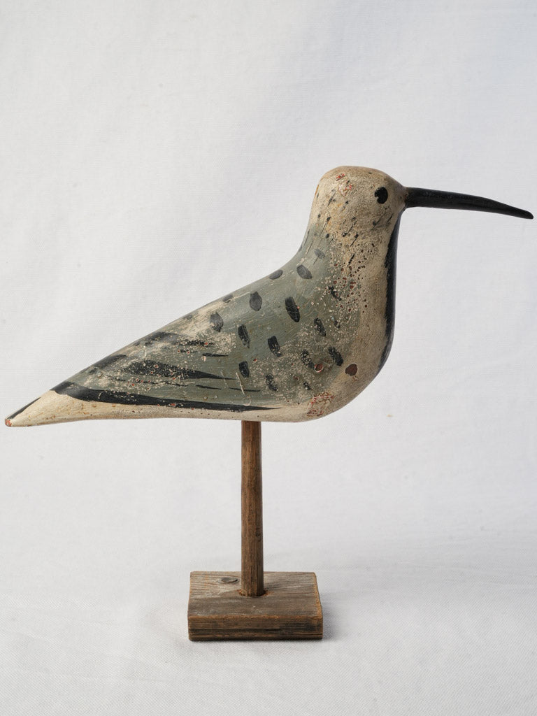 Handcrafted natural tone bird sculpture  