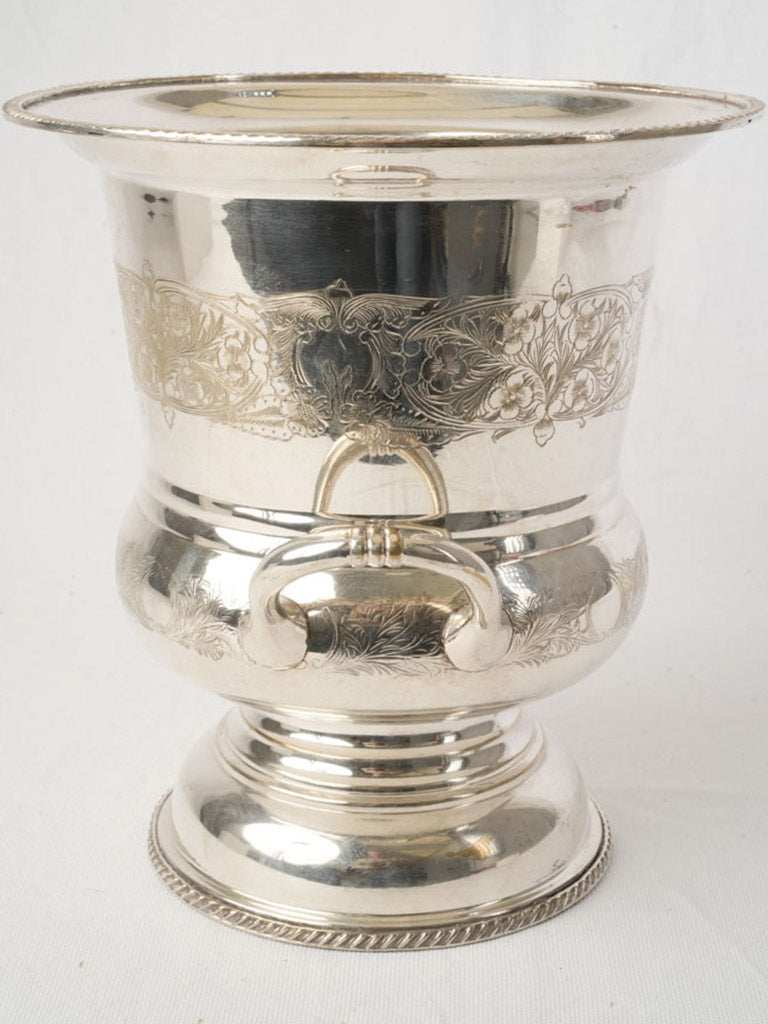 Ornate engraved silver vessel