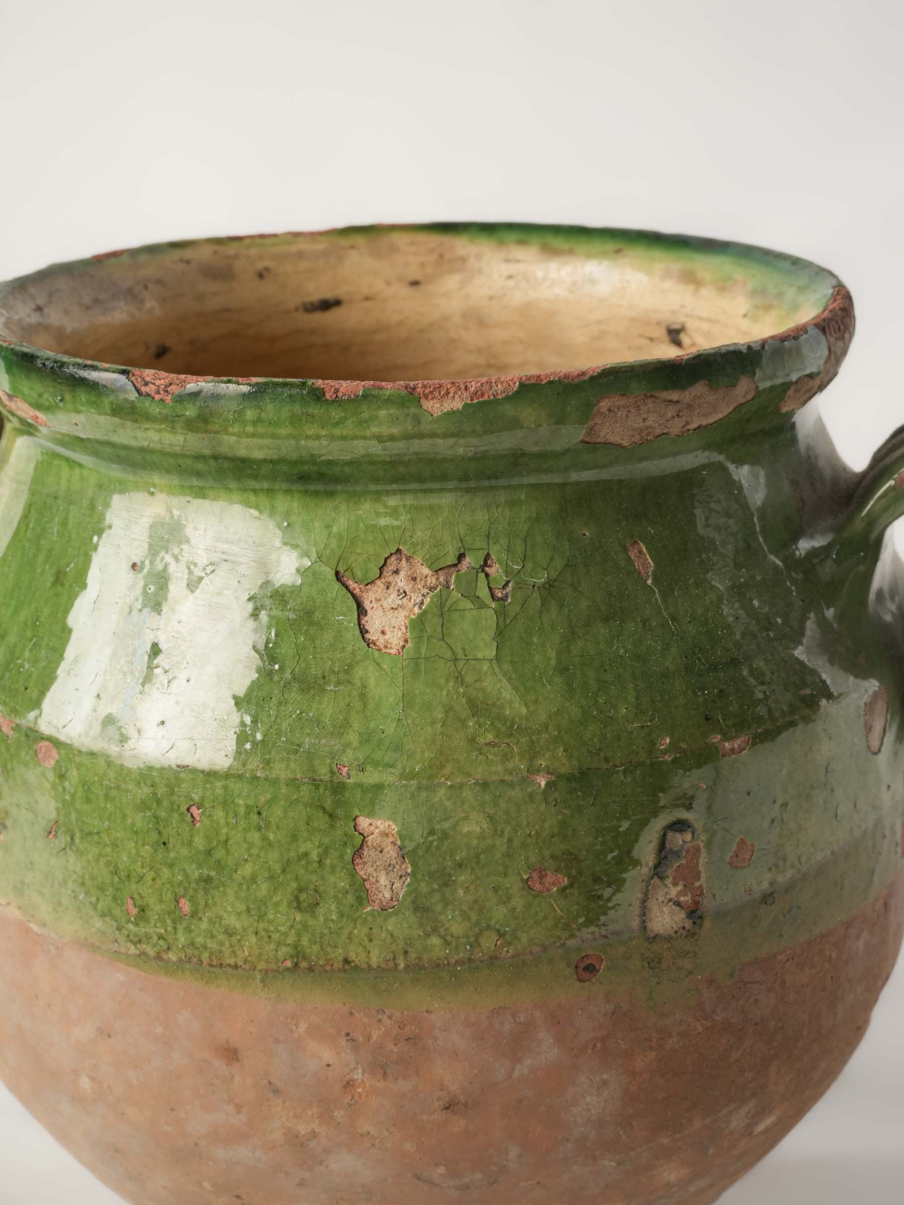 Timeworn clay olive-glazed pot  