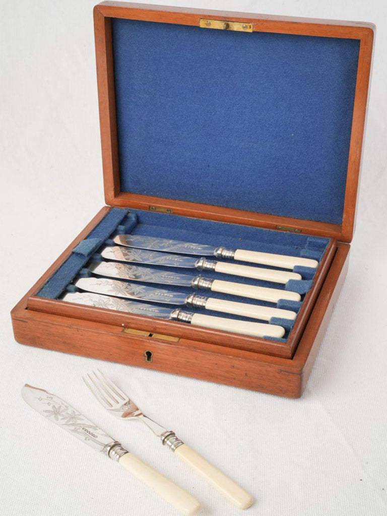 Elegant engraved fish knife set
