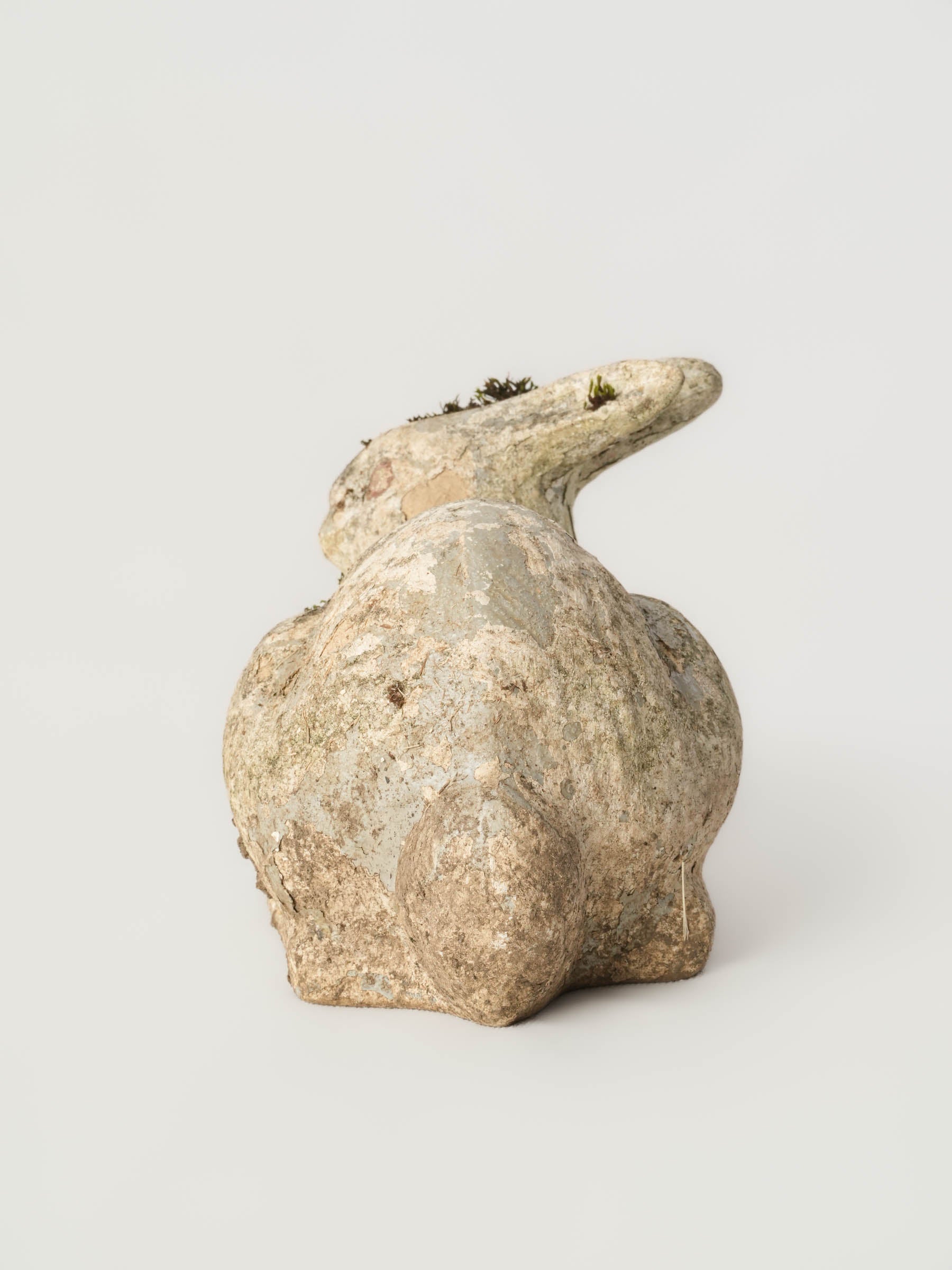 Timeworn ceramic bunny garden ornament  