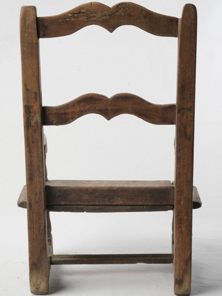 Graceful worn patina armchair