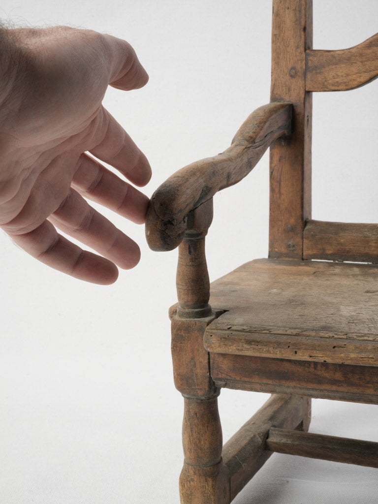 Sturdy weathered armrest chair