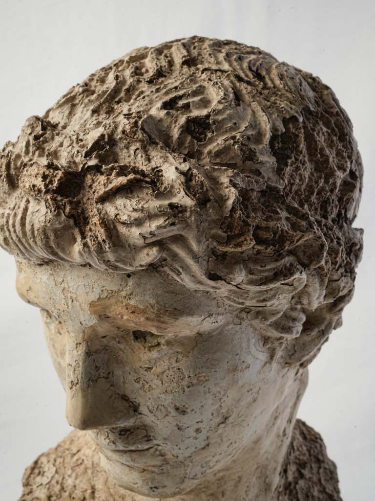 Rustic weathered-art bust.