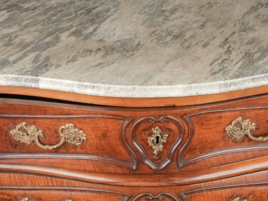 Aged Regence commode with carving