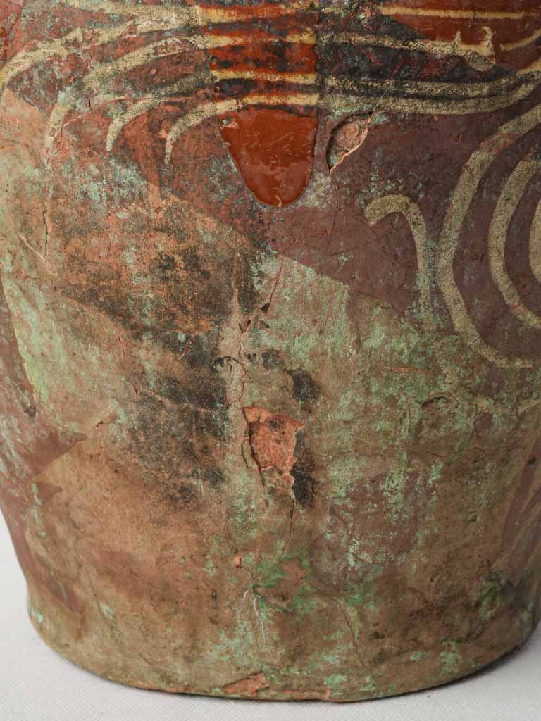 Artisanal Burgundy ceramic jar.