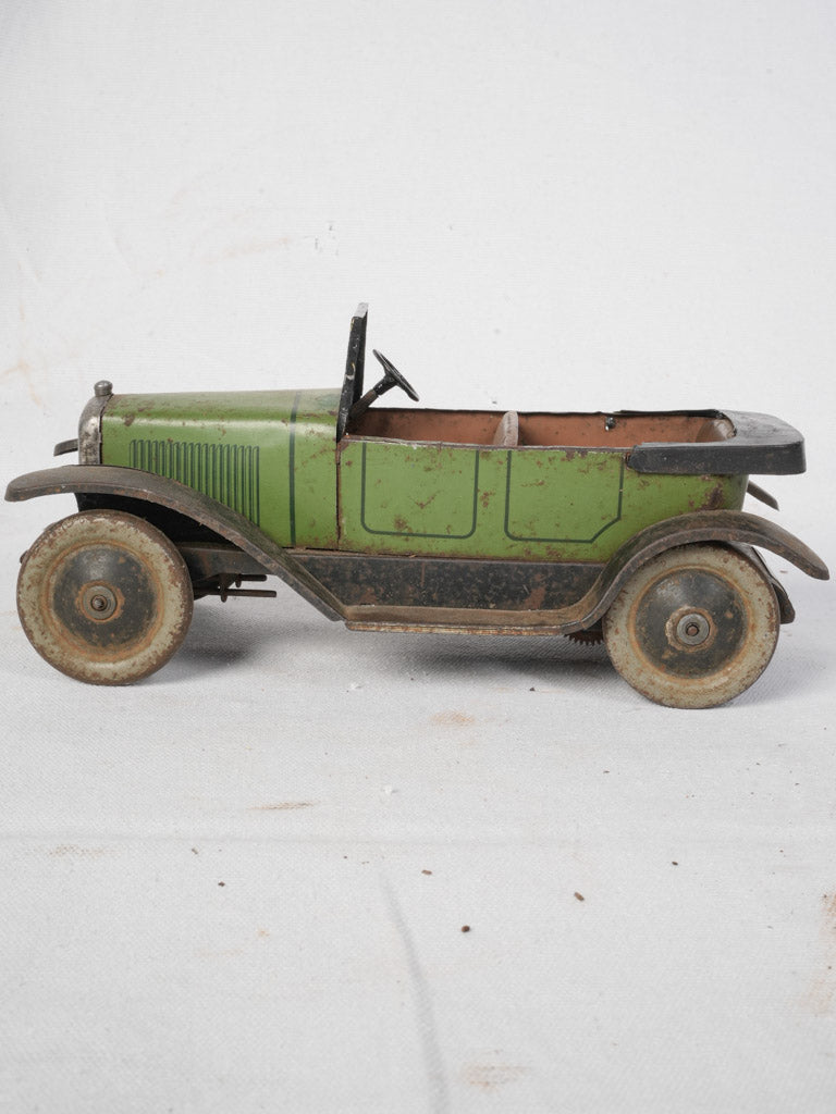 Detailed stamped miniature touring car  