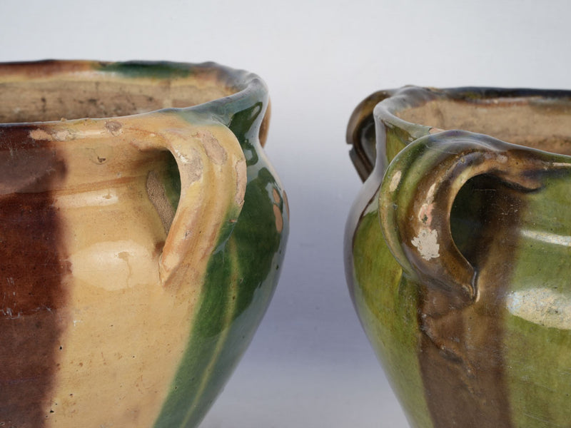 Aged green and brown flowerpots