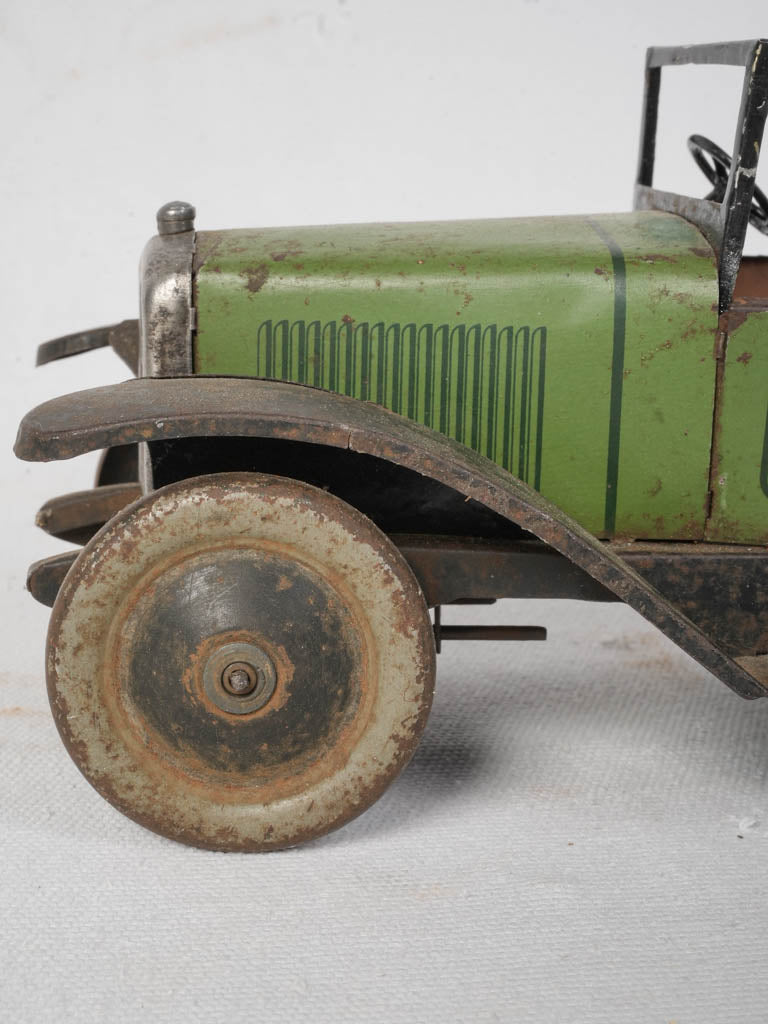 Green and black Peugeot toy model  