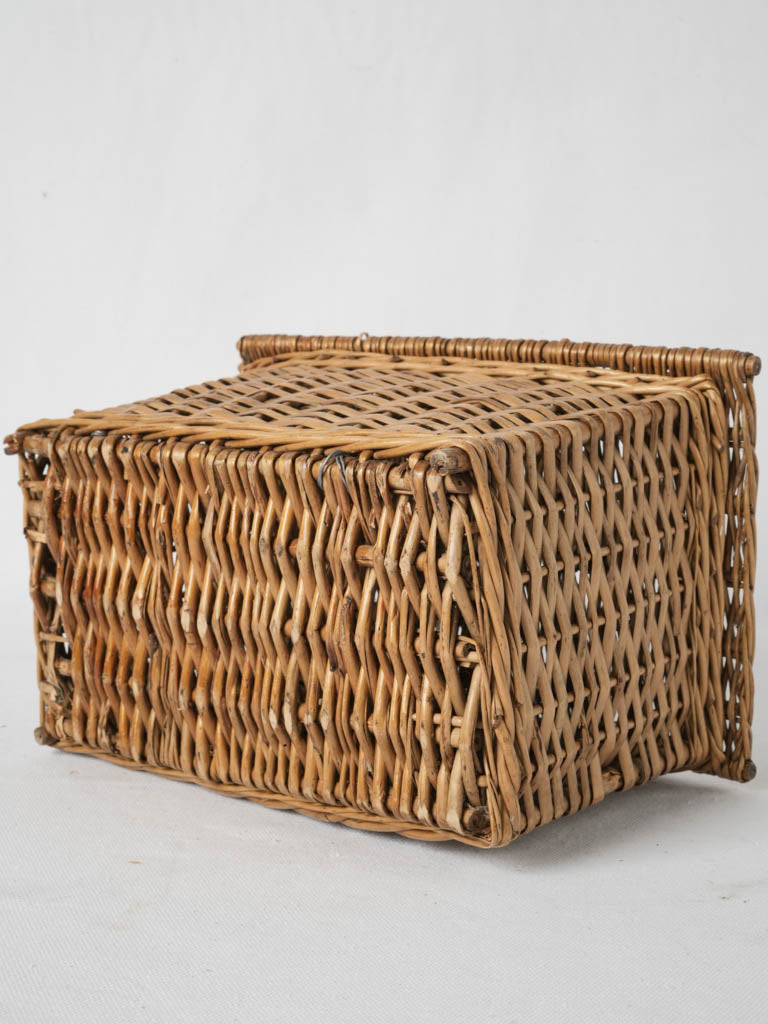 Aged artisanal wicker goûter basket