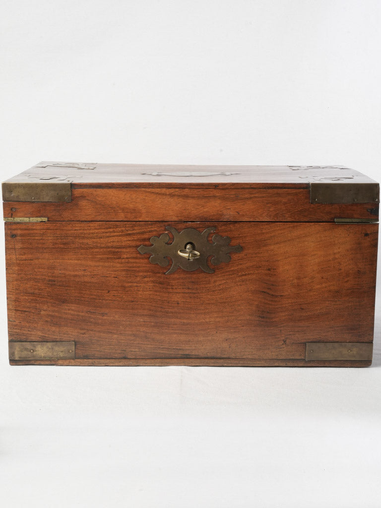 Artisanal brass-accented trunk  