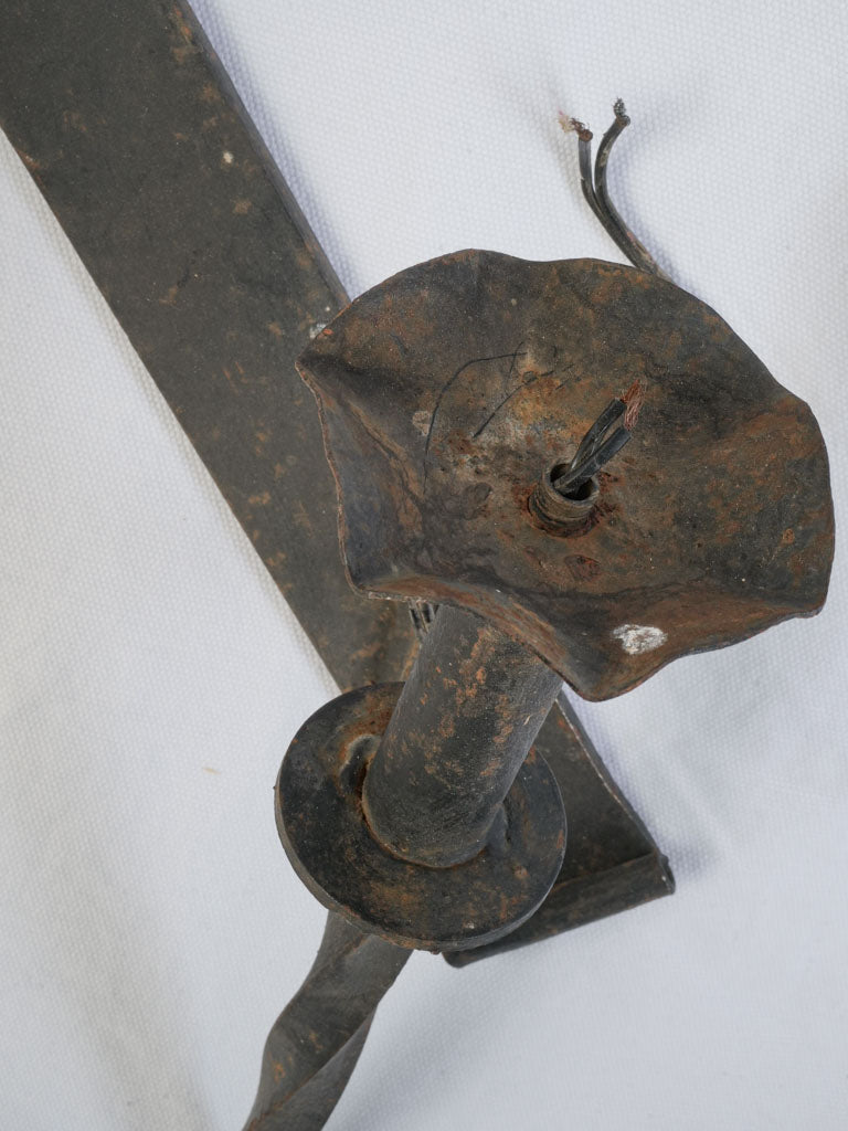 Twisted arm electrical wall fittings  