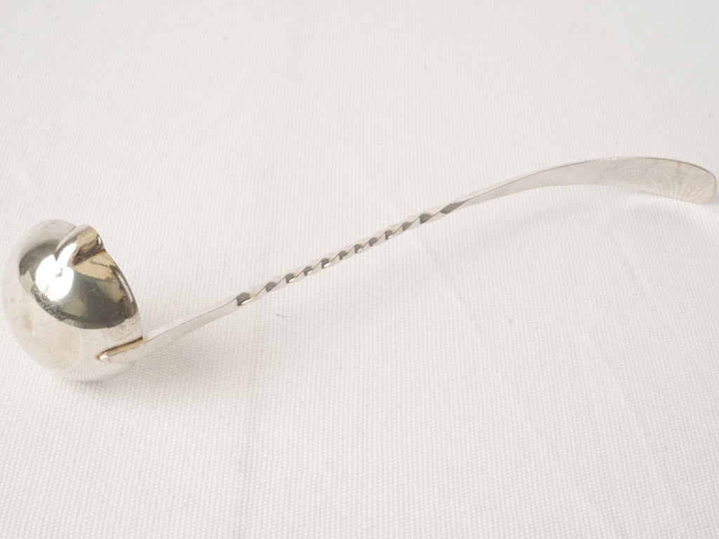 Bright silver-plated serving ladle