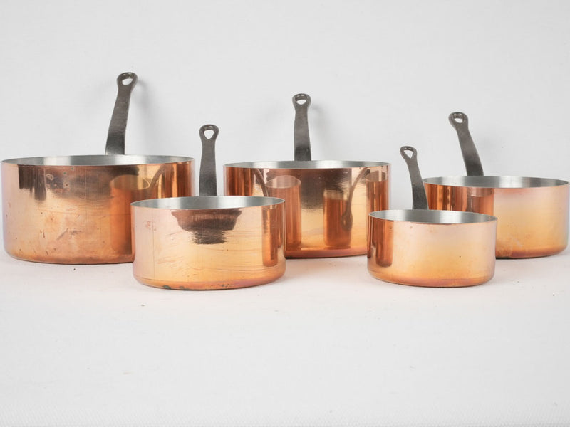 Collection of vintage French copper saucepans