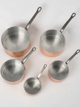 Collection of vintage French copper saucepans