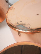 Collection of vintage French copper saucepans
