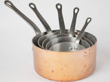 Collection of vintage French copper saucepans