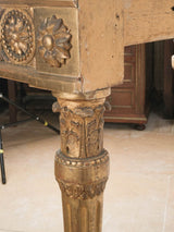Ebonist-inspired gilded wood console