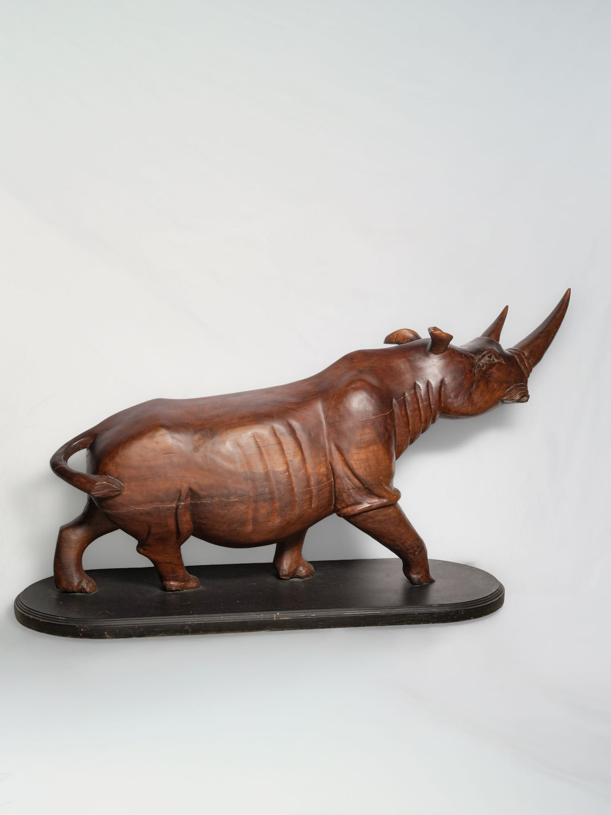 Monumental Mid-Century Monoxylous Hand-Carved Hardwood Rhinoceros, c. 1960 - 41"  x 75½"