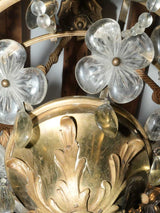 Intricate brass chandelier with glass flowers