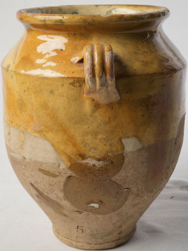 Weathered ocher sculptural earthen jar  