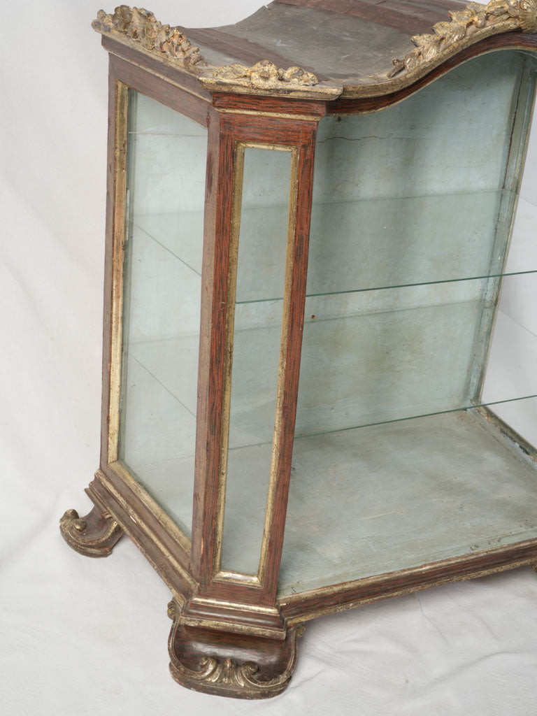 Elaborate gold-accented vitrine