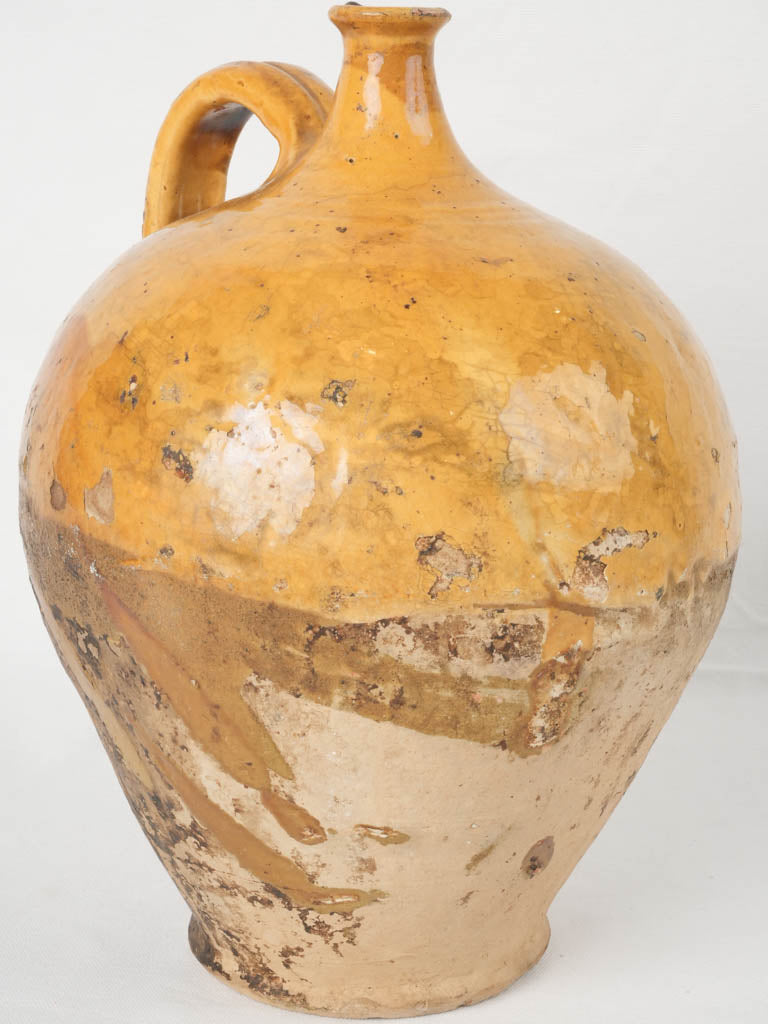 Antique French ocher glazed wine pitcher
