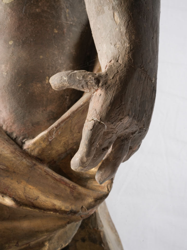 Expressive almond-eyed putti carvings  