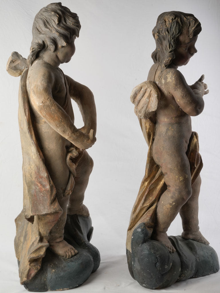 Regal early 18th-century putti pair  