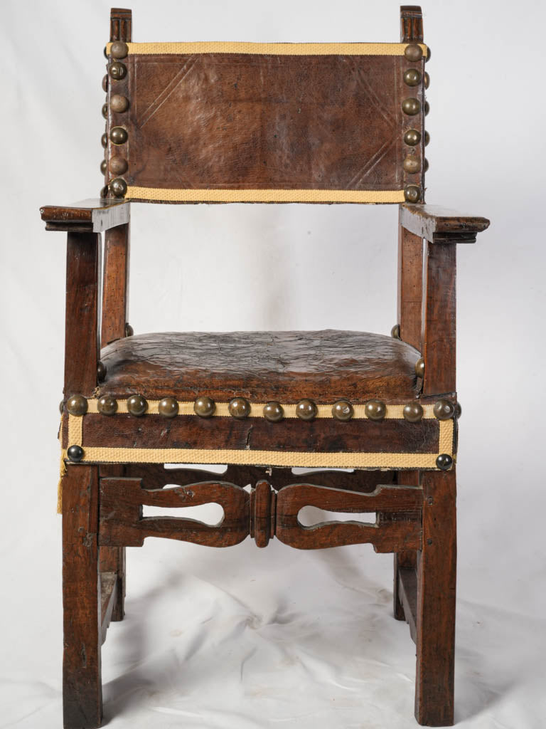 Intricate hand-carved wood armchair  