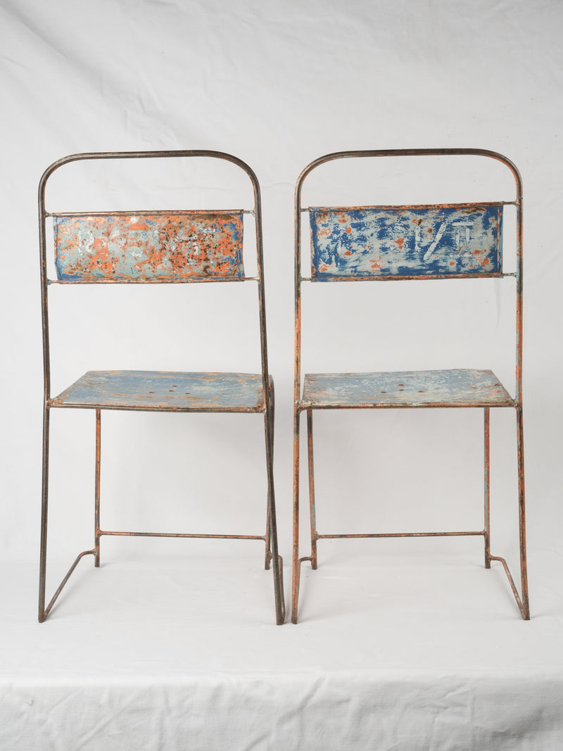 Patina-finished metal garden chairs