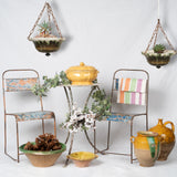 Aged peach and blue metal chairs