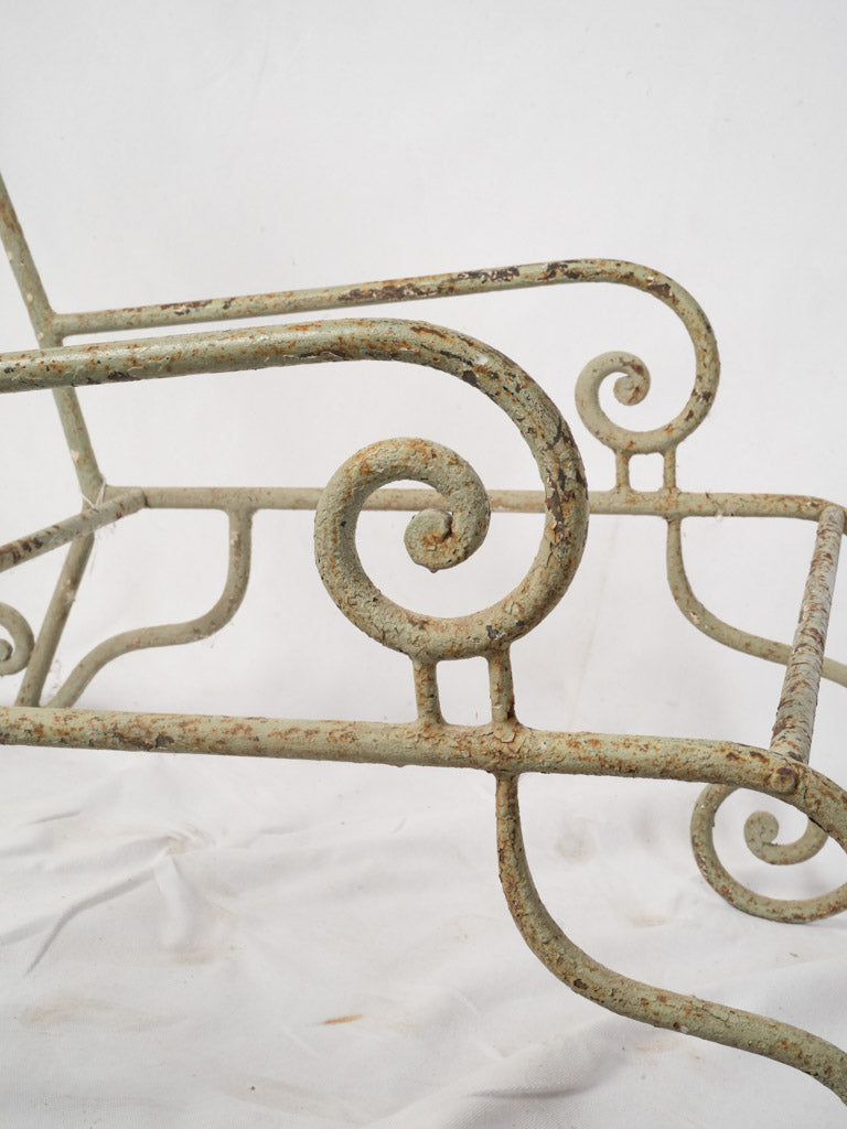 Distinctive aged iron armchair frames  