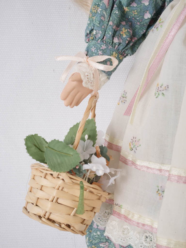 Graceful, vintage blue-eyed porcelain doll