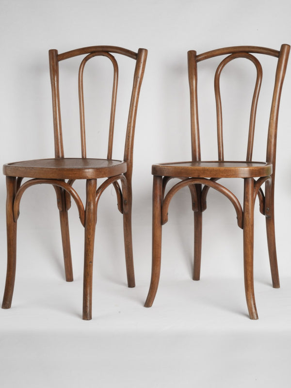 Inexact pair of Thonet-style bistro chairs - L Buchon