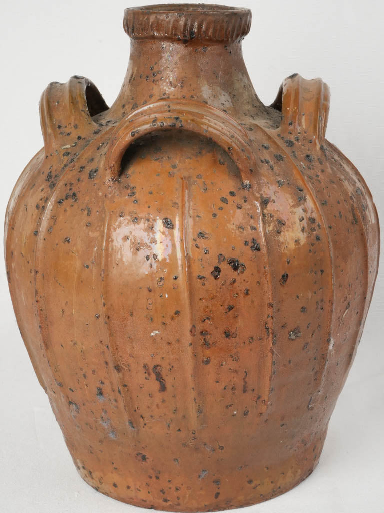 Textured ribbed clay oil jar  
