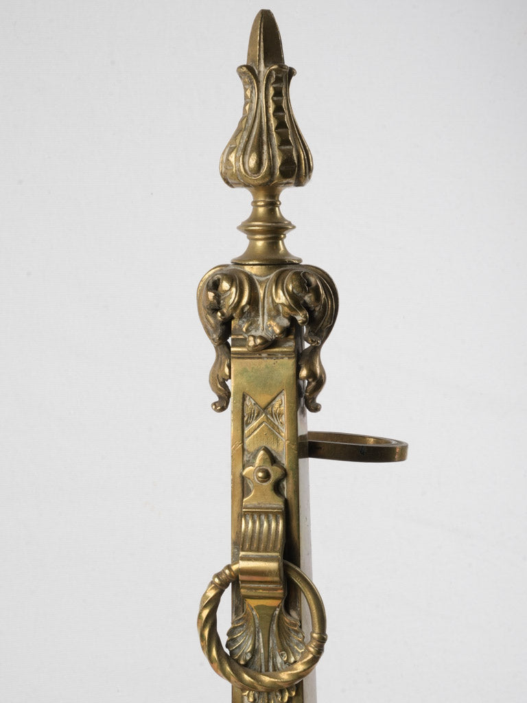 Dramatic flame finial fireplace ensemble