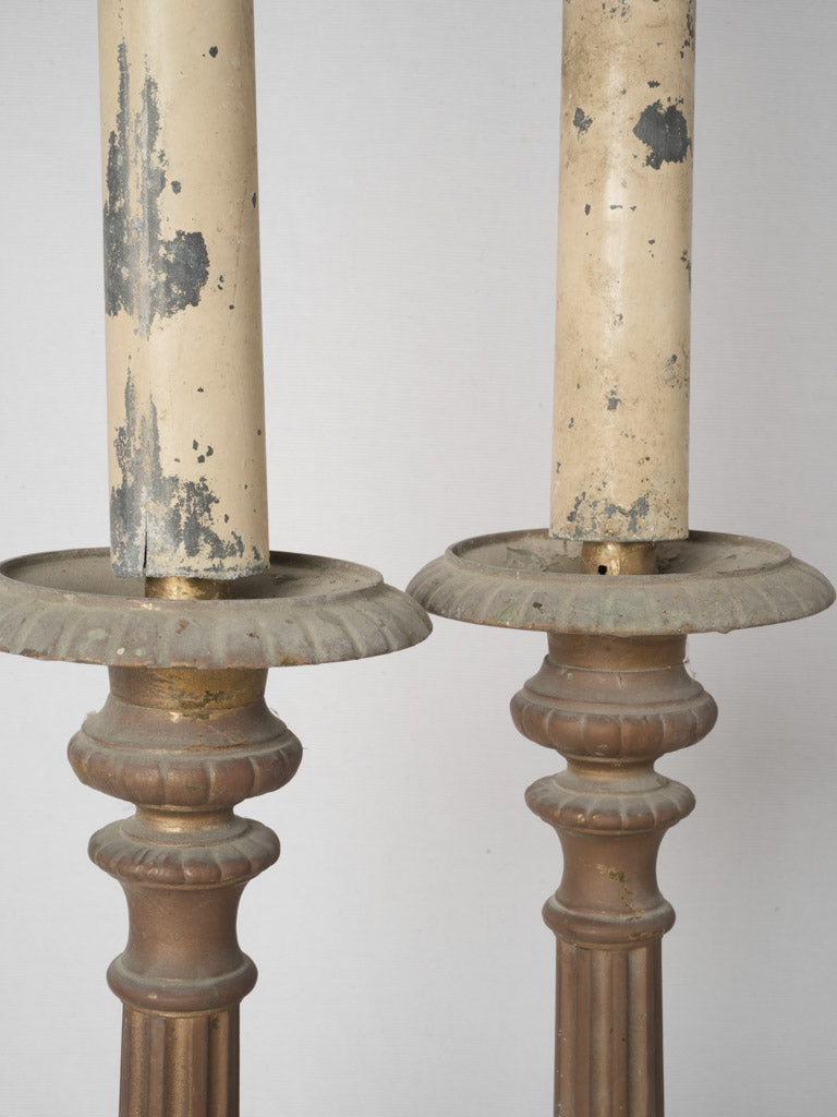 Verdigris-patinated gilded church candlesticks