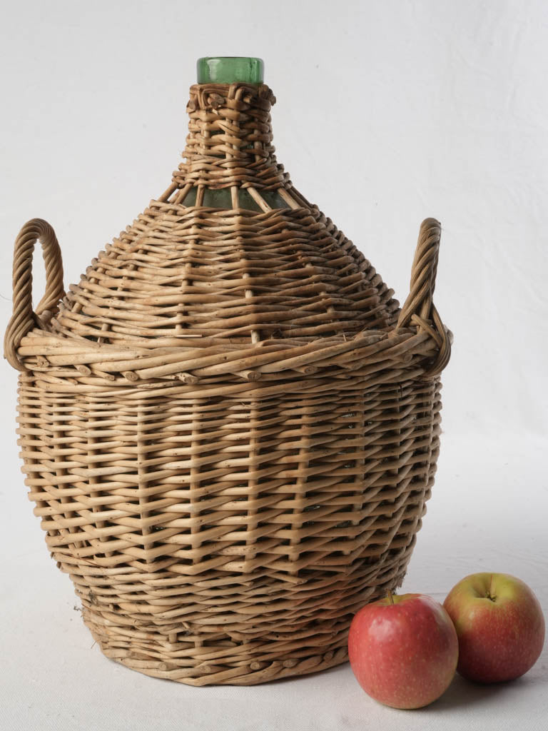 Patinated woven wicker demijohn bottle  