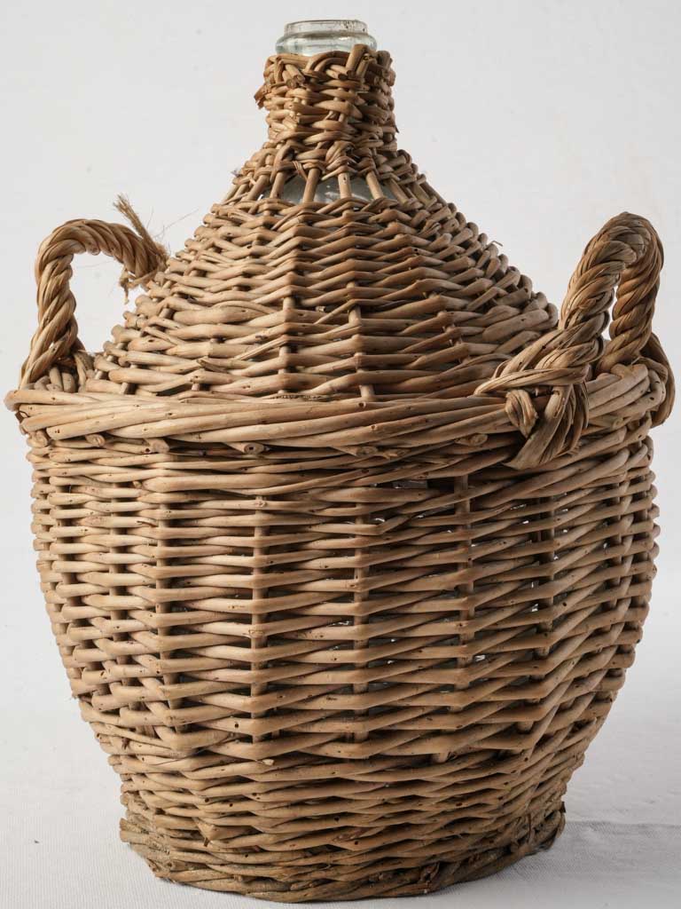 Vintage rustic glass demijohn