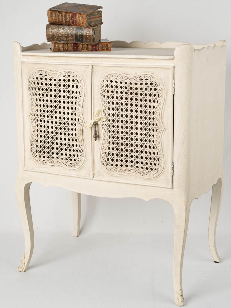 Charming antique white cane nightstand  