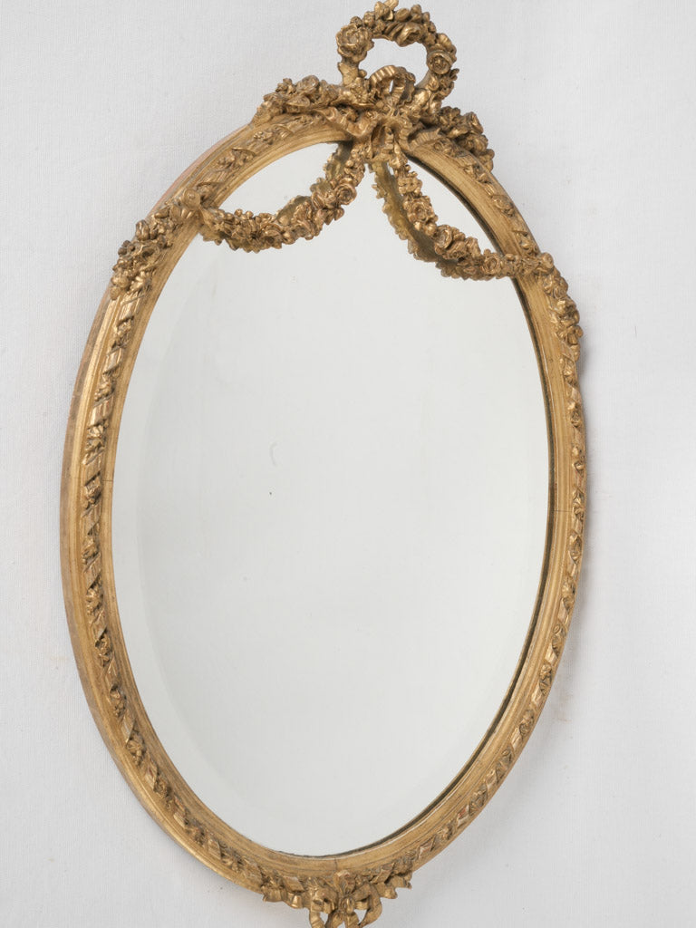 Vintage Louis XVI oval gilded mirror