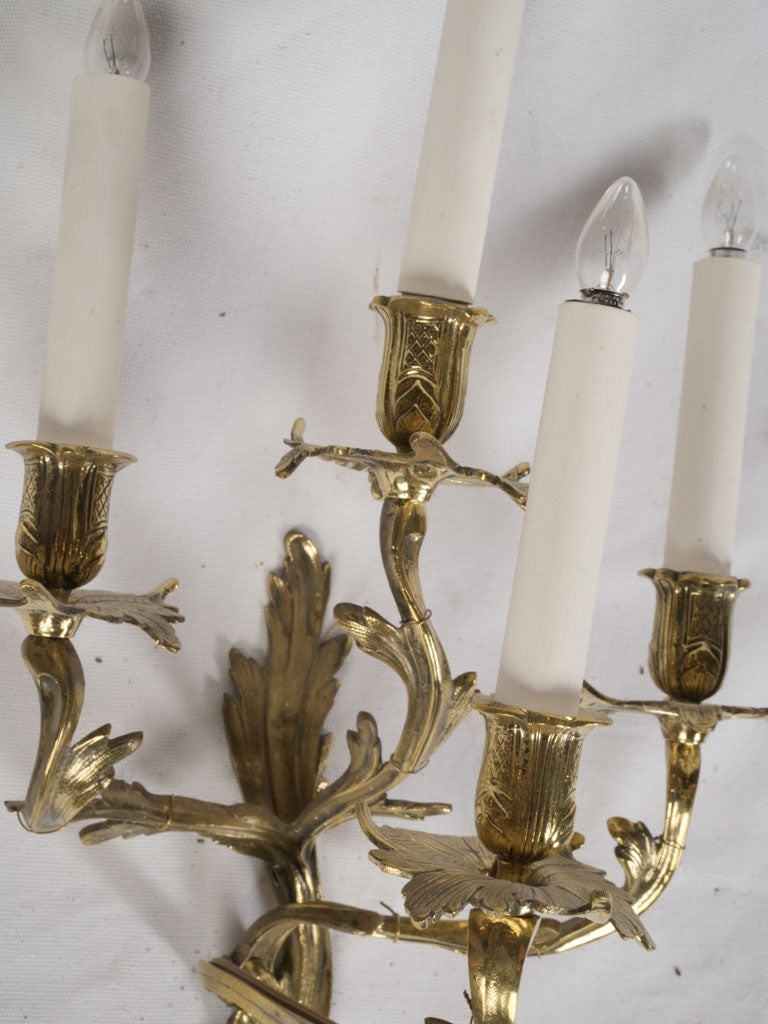 Richly carved bronze wall lights  