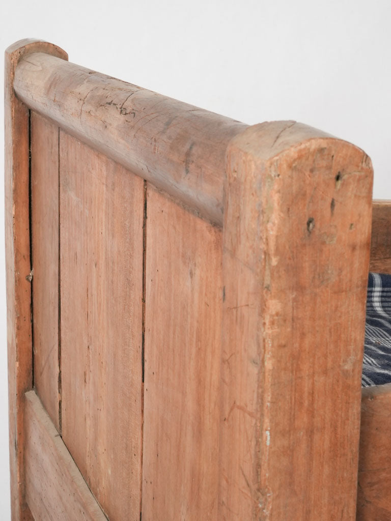 Time-worn wood child's bedstead