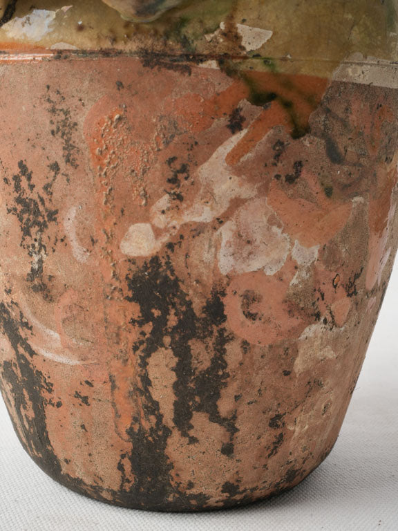 Artisanal chipped terracotta pot