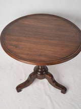 Finely turned central stem table