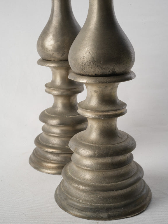 Curved silhouette antique candlesticks  